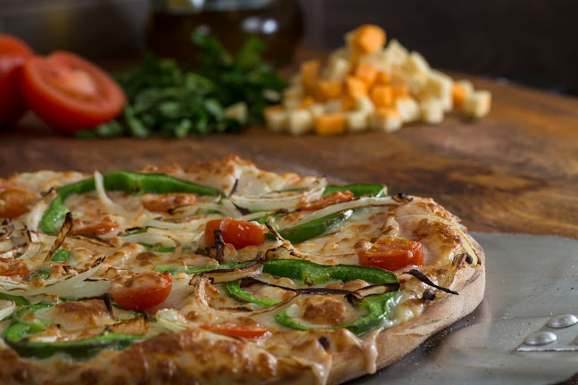 Pizzería Carlos Phone number